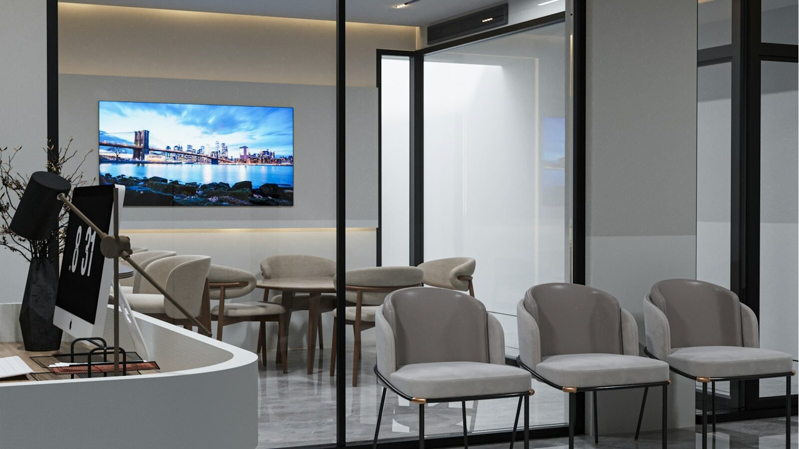 Modern commercial office meeting area with video conference screen